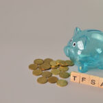 Piggy,Bank,,Stack,Of,Coins,And,Wooden,Blocks,With,Text